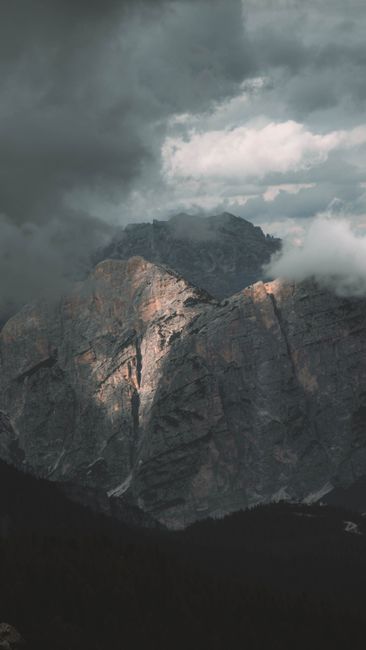 Captivating View Of Rugged Mountain Peaks Partially Shrouded In Clouds At Cortina D'Ampezzo, Italy. wallpaper preview