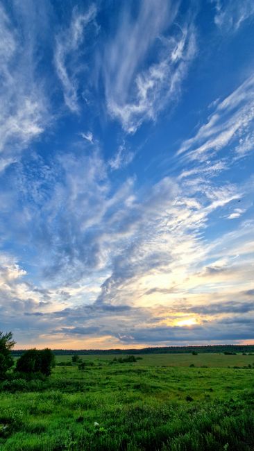 Breathtaking Rural Scene With Green Fields And A Vibrant Sunset Sky, Perfect For Nature Themes. wallpaper preview