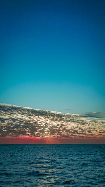 Breathtaking Sunset View Over The Calm Ocean In Zanzibar, Tanzania, Capturing The Beauty Of The Sky And Sea. wallpaper preview
