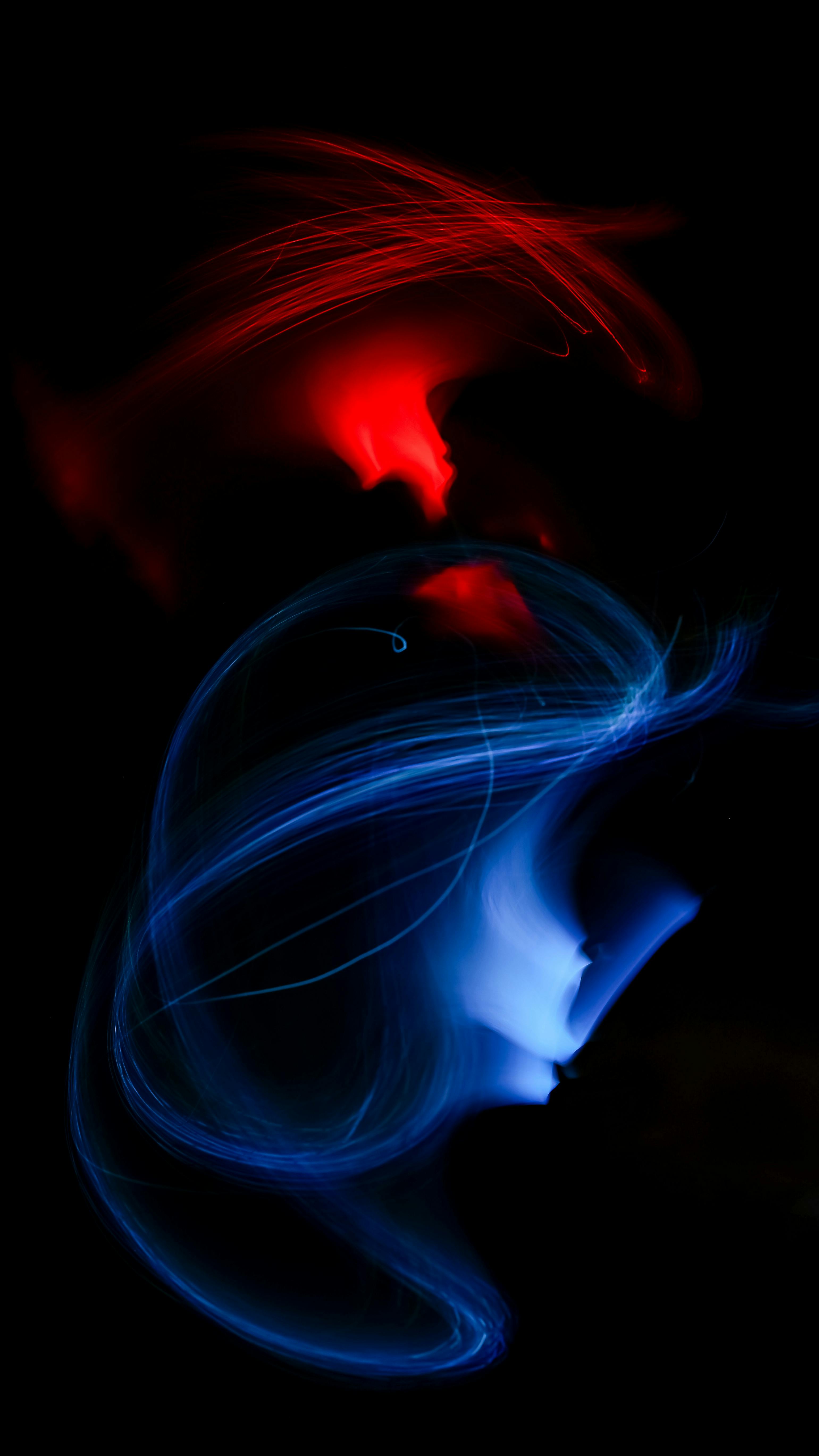 Dynamic Abstract Light Streaks In Vibrant Red And Blue Against A Dark Background. HD mobile wallpaper