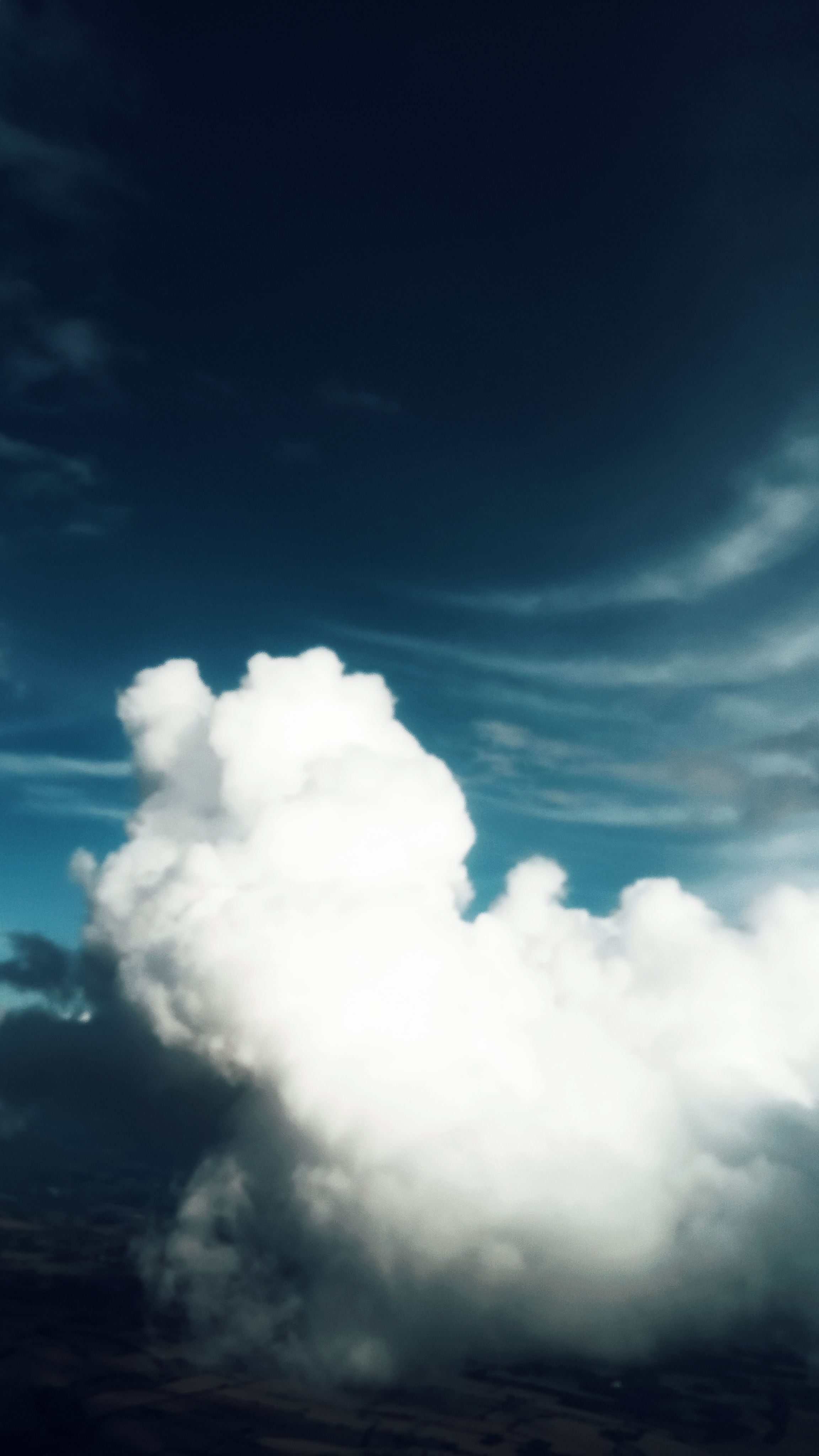 Aerial View Of Skyline With Fluffy White Clouds In Bright Blue Sky Over Ground HD mobile wallpaper