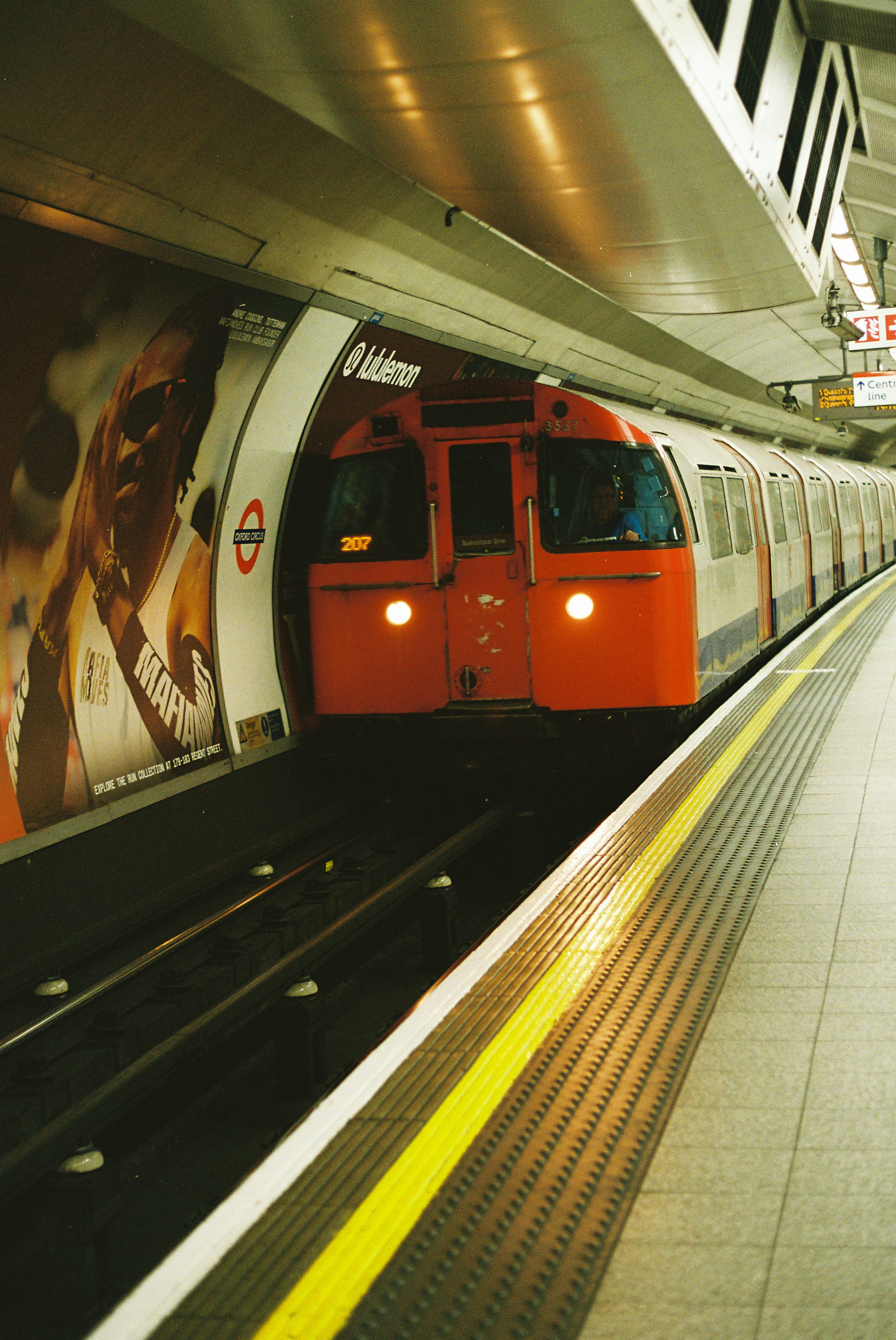 An Orange And White Subway Train Arrives At A Station. HD mobile wallpaper