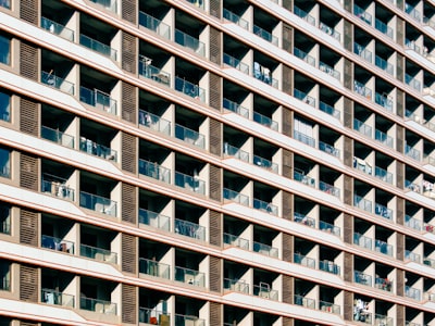 Modern Building Facade With Numerous Windows And Balconies. wallpaper preview