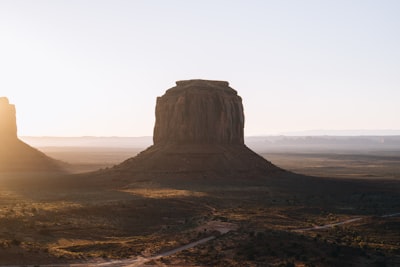 Monument Valley At Sunrise With Warm Light. wallpaper preview
