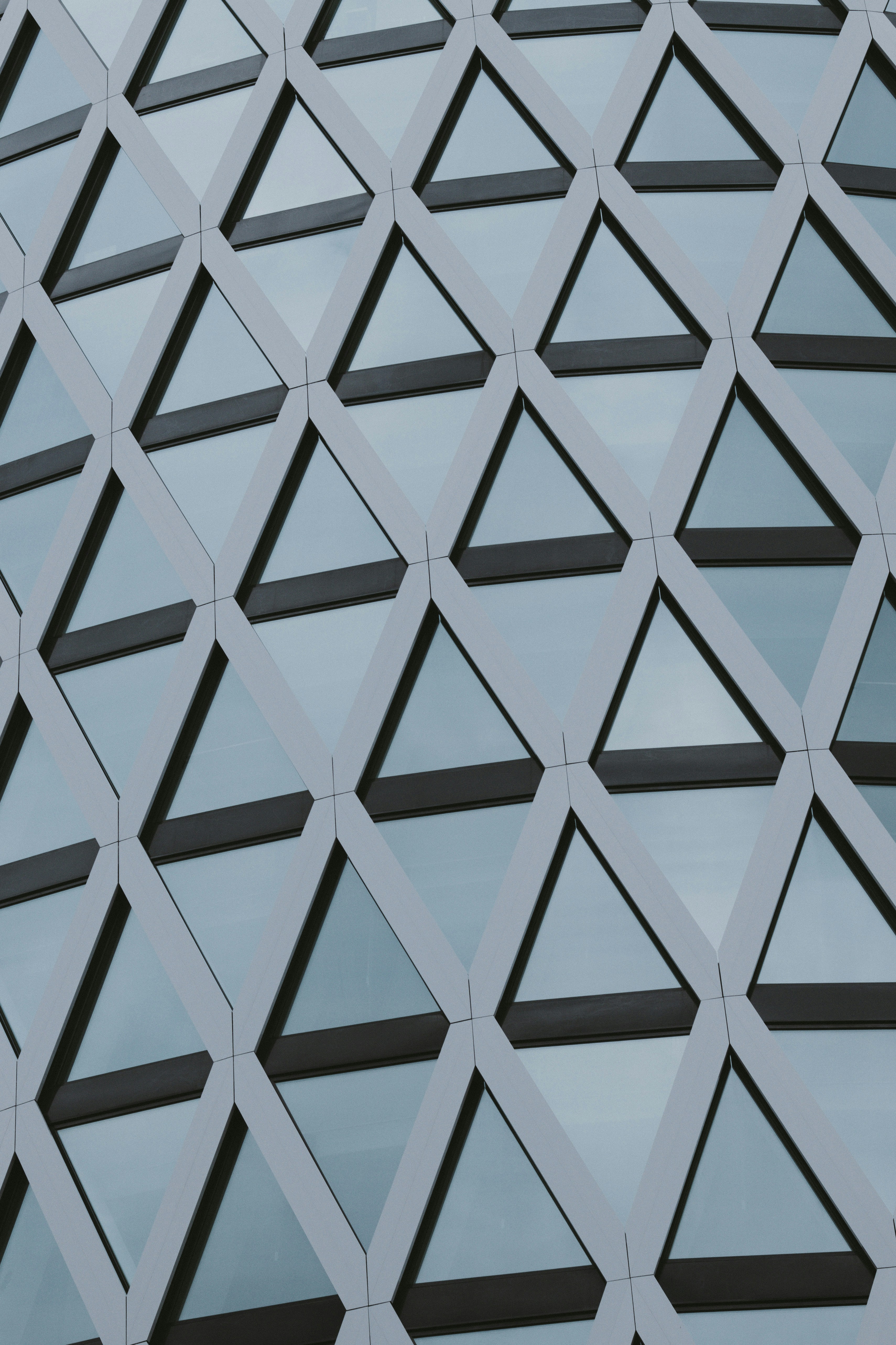 Geometric Pattern Of Triangular Windows On A Building HD mobile wallpaper