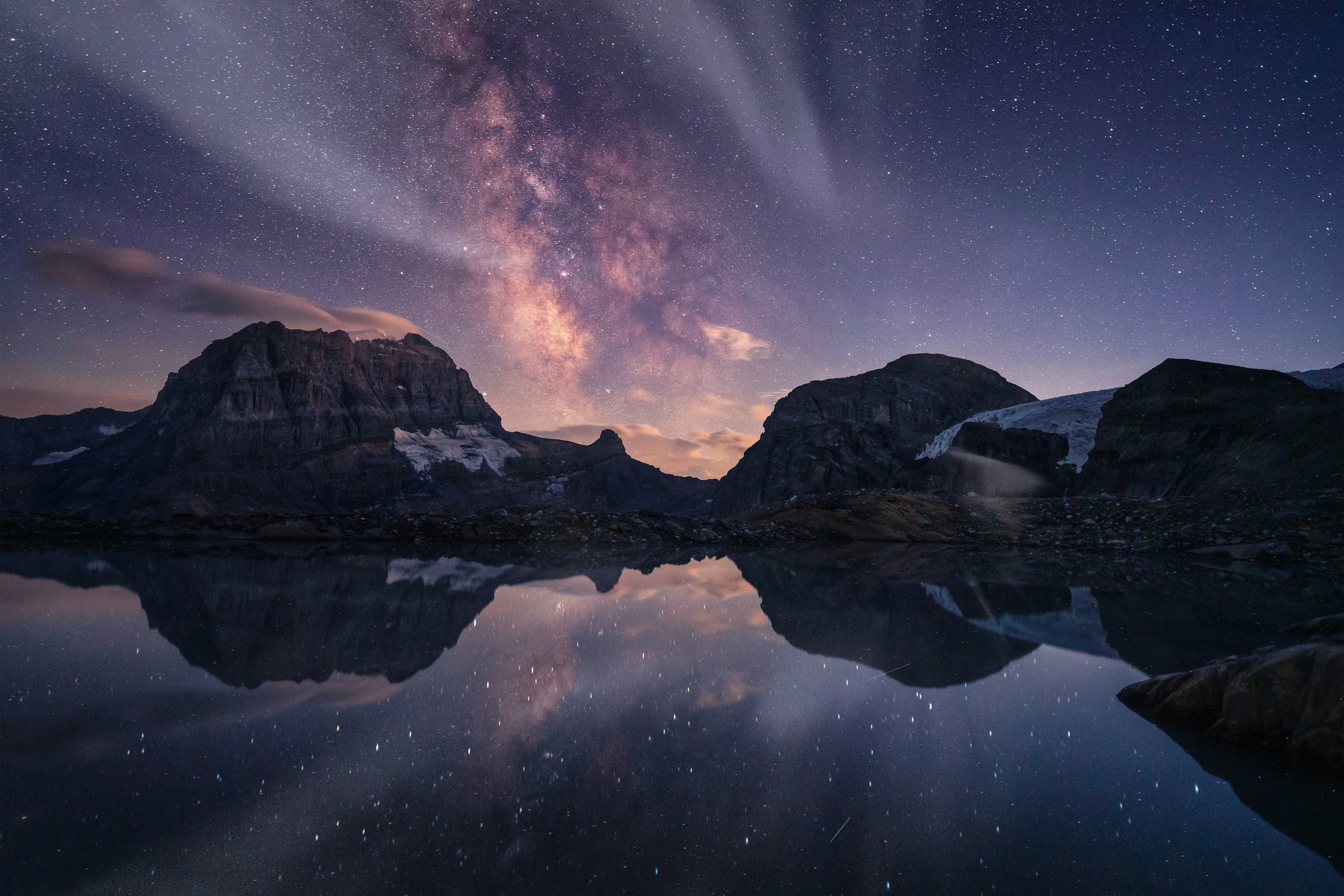 After A Long And Exhausting Climb, I Reached This Remote Alpine Lake Just As Darkness Fell. Tired But Determined, I Set Up My Tent And Watched The Milky Way Rise Above The Mountains, Perfectly Reflected In The Still Water. Shortly After Capturing This Image, Thunder Rolled Through The Valley. A Storm Was Approaching, And With No Phone Signal, All I Could Do Was Retreat Into My Tent And Wait. Moments Like These Are Why I Love Mountain Photography. The Effort, The Uncertainty, And The Reward. Looking Back, Every Step Of The Climb Was Worth It. HD mobile wallpaper