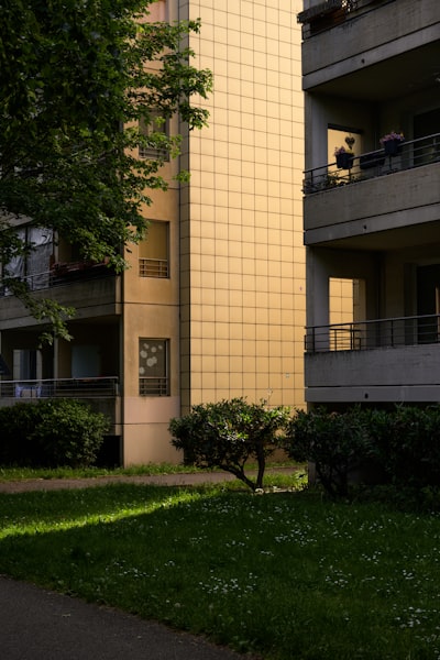 Golden Building Facade Illuminated By Sunlight Between Two Apartment Blocks. wallpaper preview