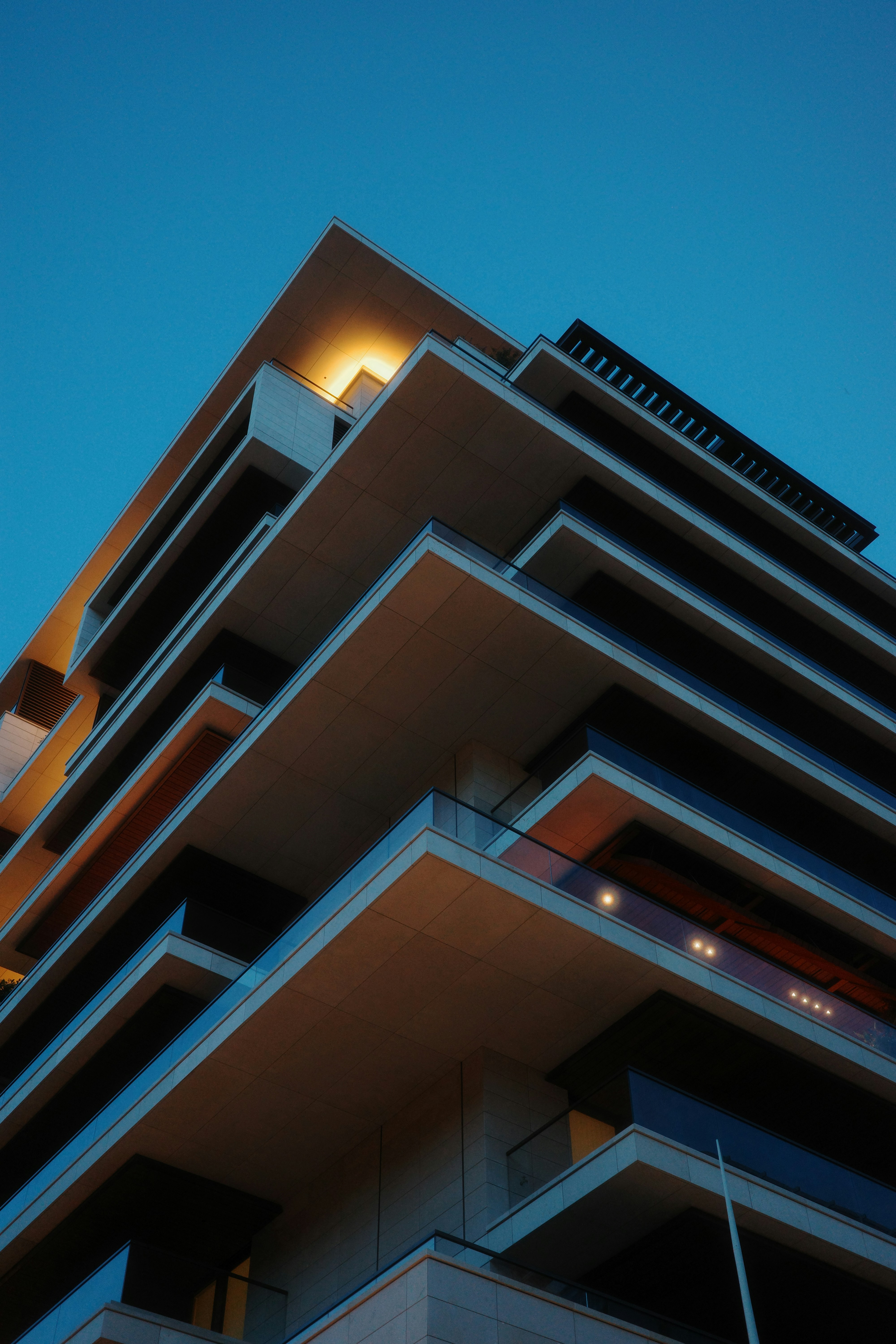 Modern Building With Layered Balconies At Dusk HD mobile wallpaper