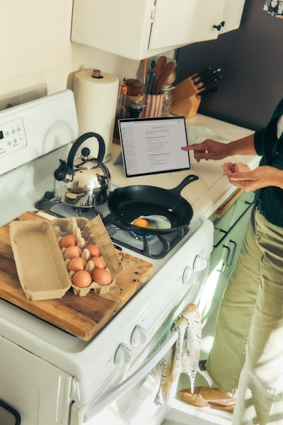 Person Cooking Eggs On A Stovetop Following A Recipe. wallpaper preview