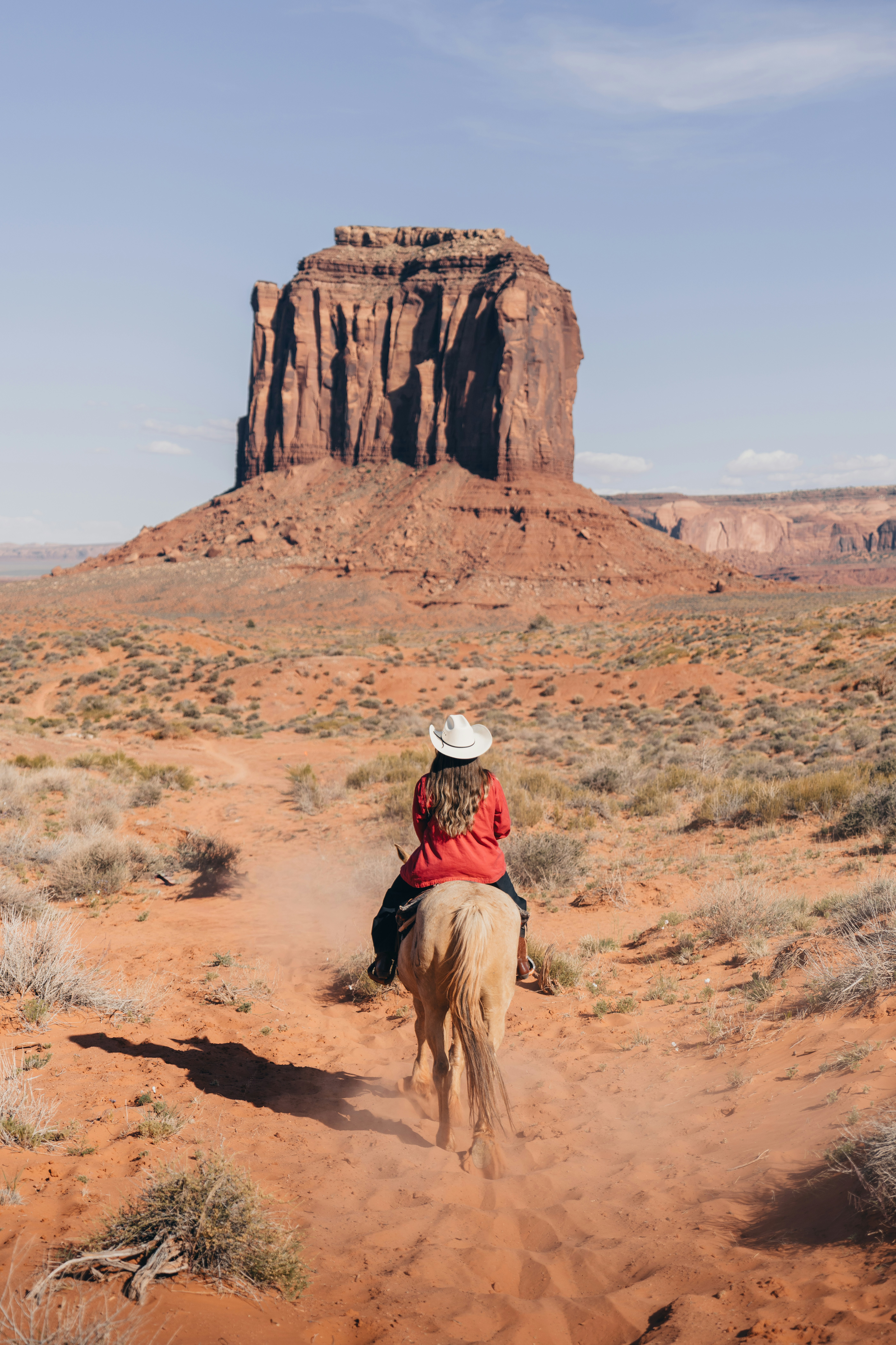 Woman Rides Horse Towards Monument Valley Mesa HD mobile wallpaper