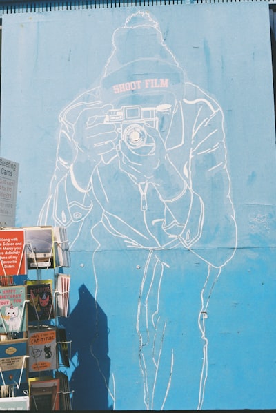 Mural Of Person Holding Camera,