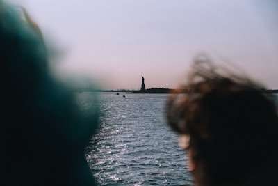 Statue Of Liberty Seen Across Sparkling Water. wallpaper preview