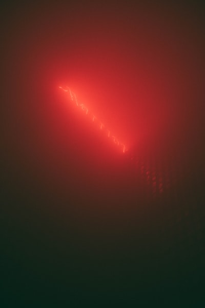 Glowing Red Light Forming A Triangle On A Dark Background. wallpaper preview