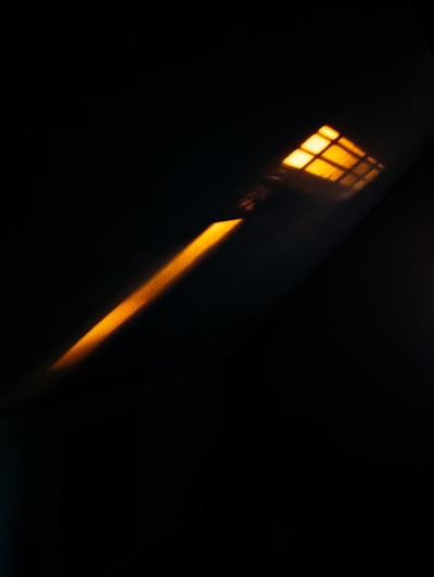 A Single Light Source Casts A Bright Orange Glow wallpaper preview