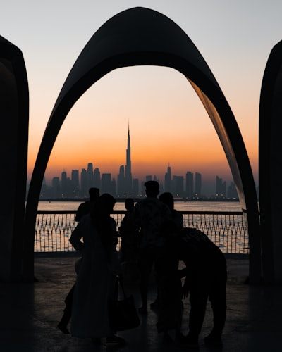 Silhouettes Watch Sunset Over Dubai Skyline And Burj Khalifa. wallpaper preview