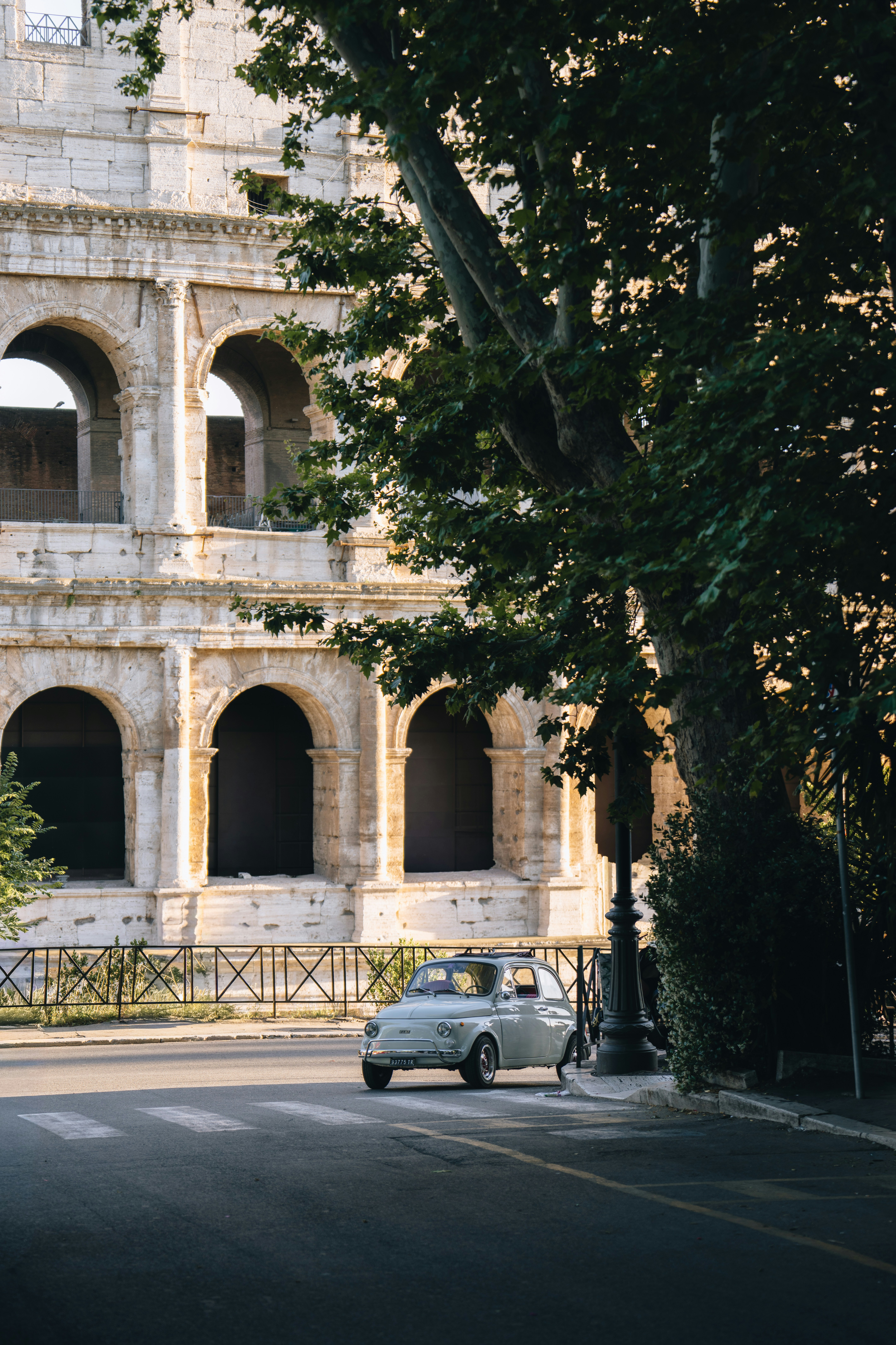 Vintage Car Parked Near The Colosseum With A Large Tree. HD mobile wallpaper