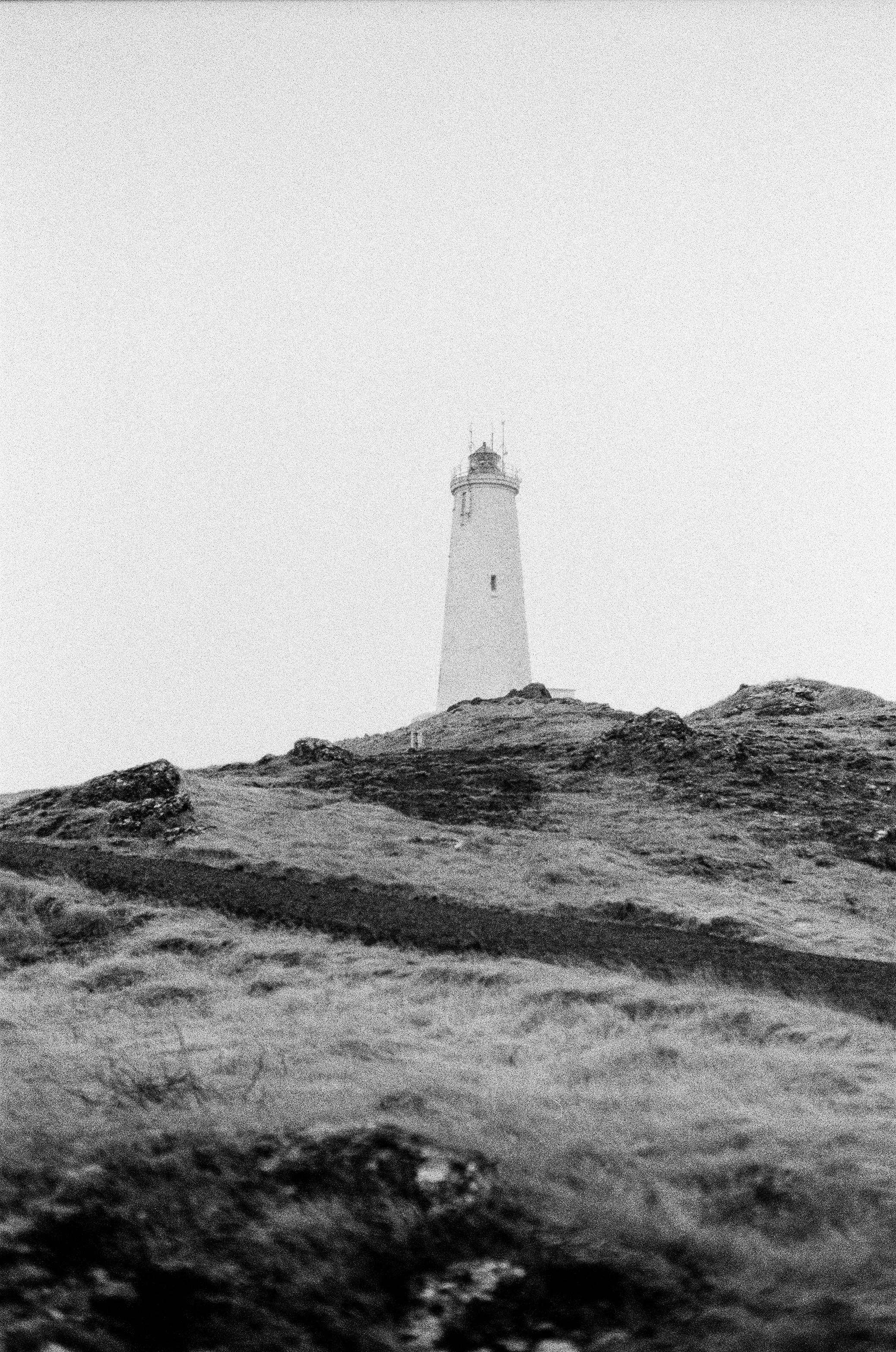 A Lighthouse Stands On A Grassy Hill. HD mobile wallpaper