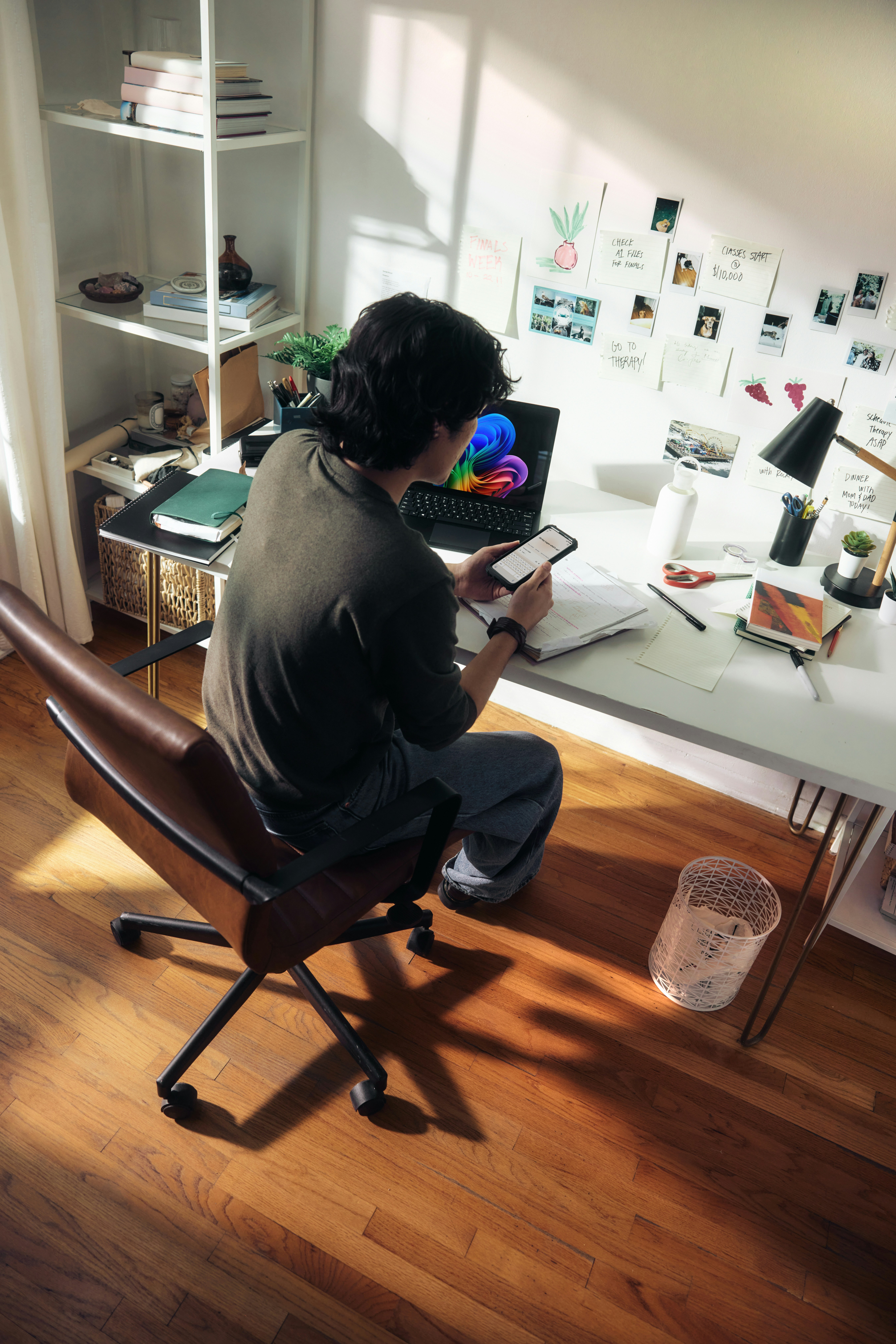 Man Working At Desk With Laptop And Phone. HD mobile wallpaper