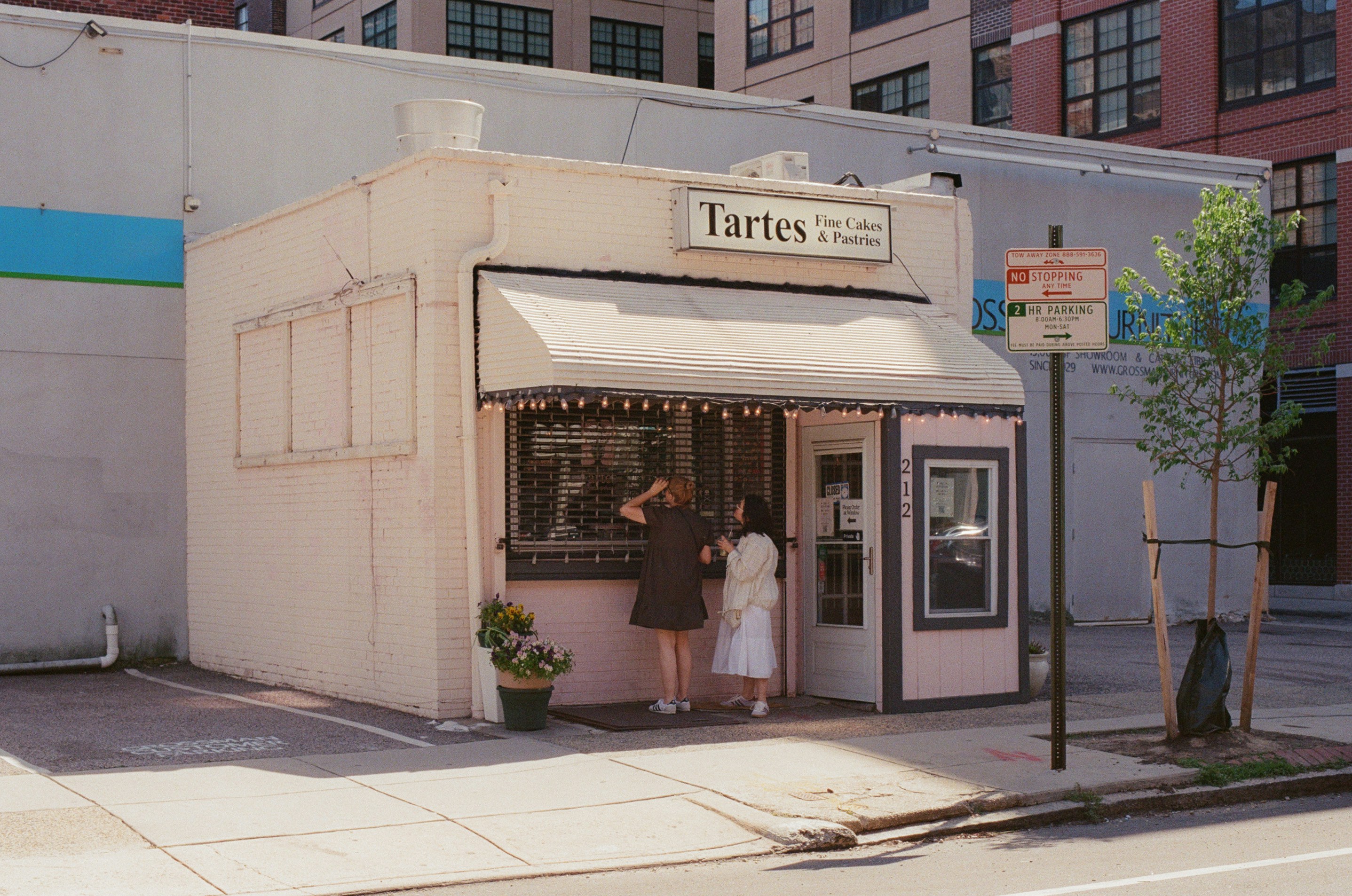 Two Customers Stop Outside A Small Neighborhood Bakery On A Sunny Afternoon In Philadelphia. HD mobile wallpaper