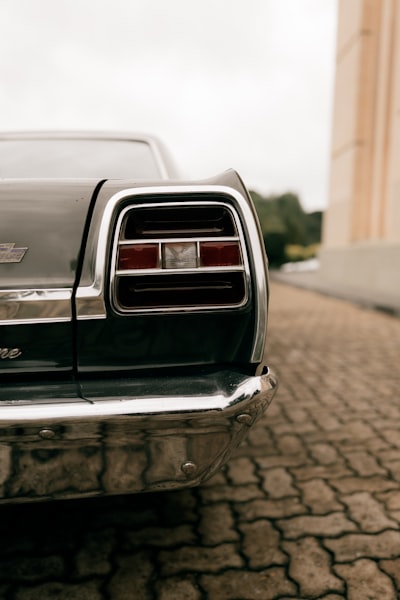 Close-up Of A Vintage Car's Taillight And Bumper. wallpaper preview