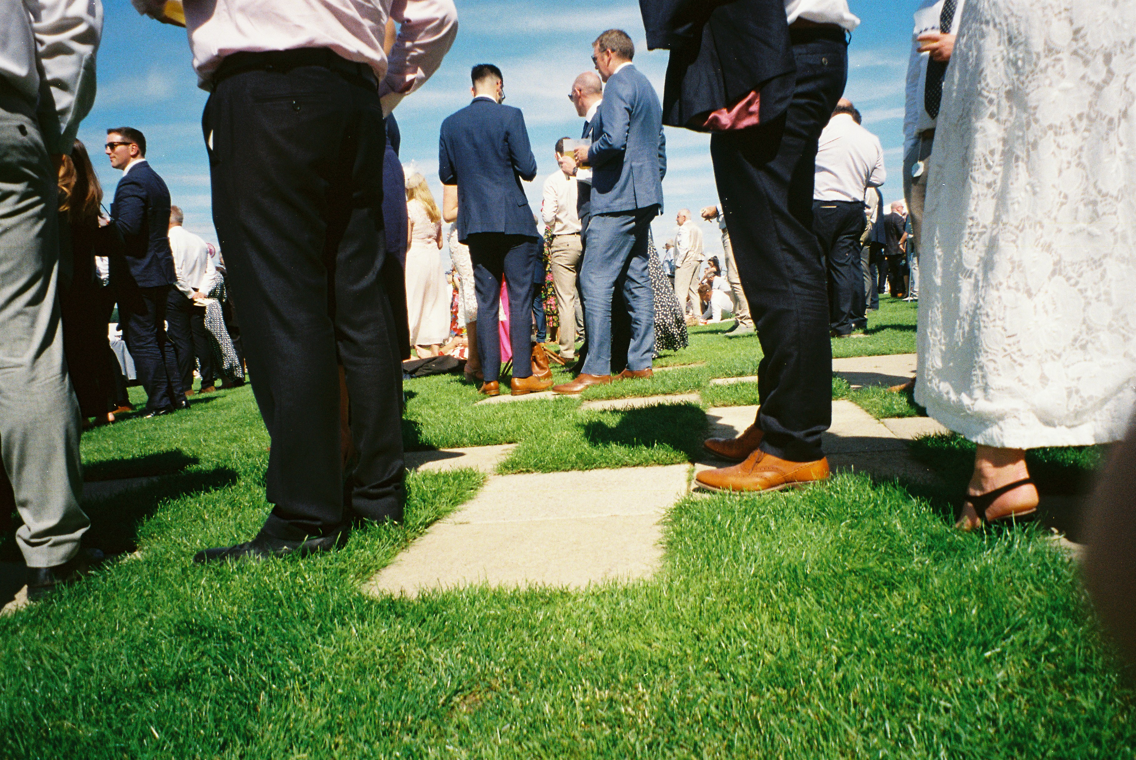 Guests In Formal Wear Standing On Green Lawn HD mobile wallpaper