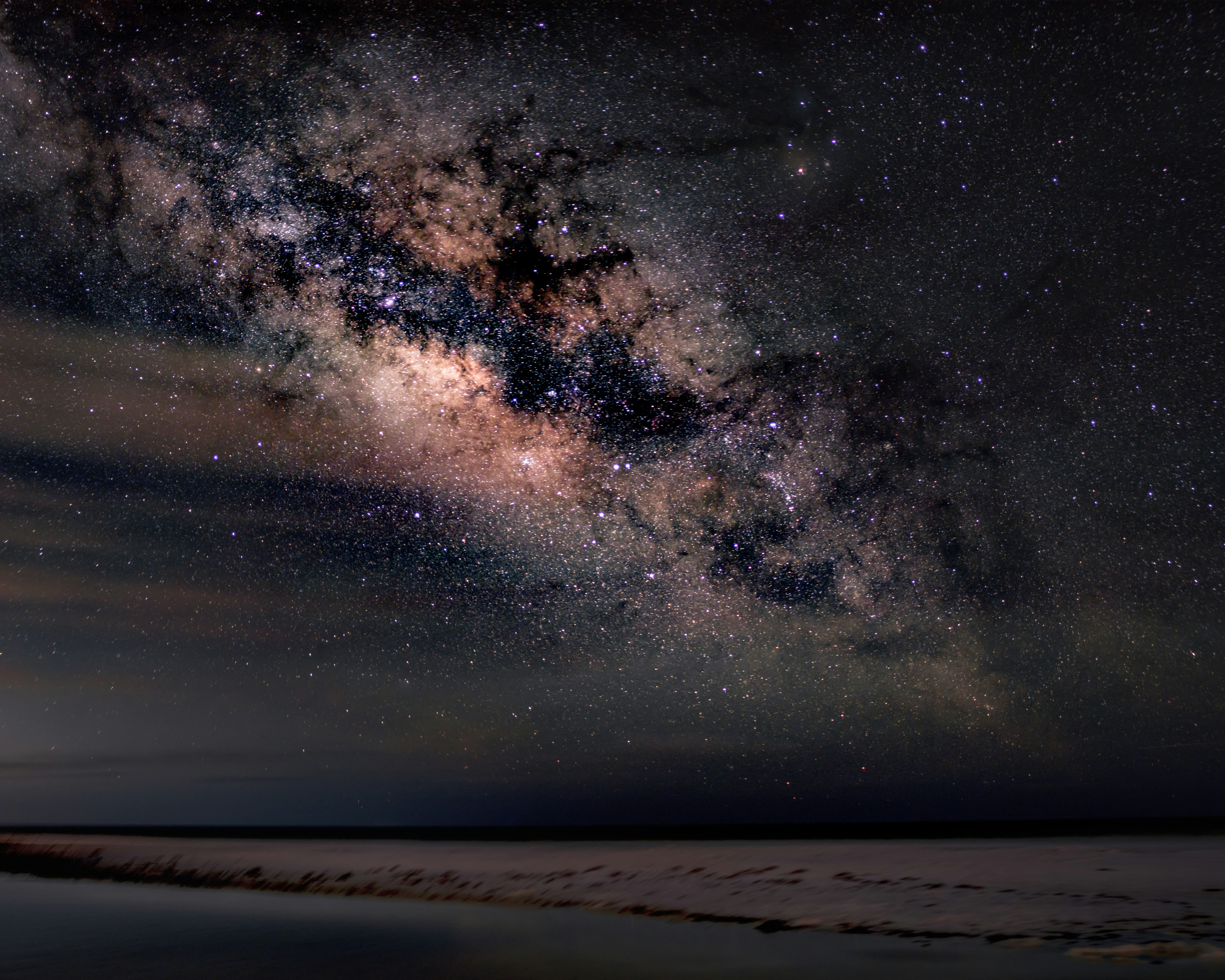 The Milky Way Stretches Across A Clear Night Sky Above A Peaceful Coastal Shoreline. HD mobile wallpaper