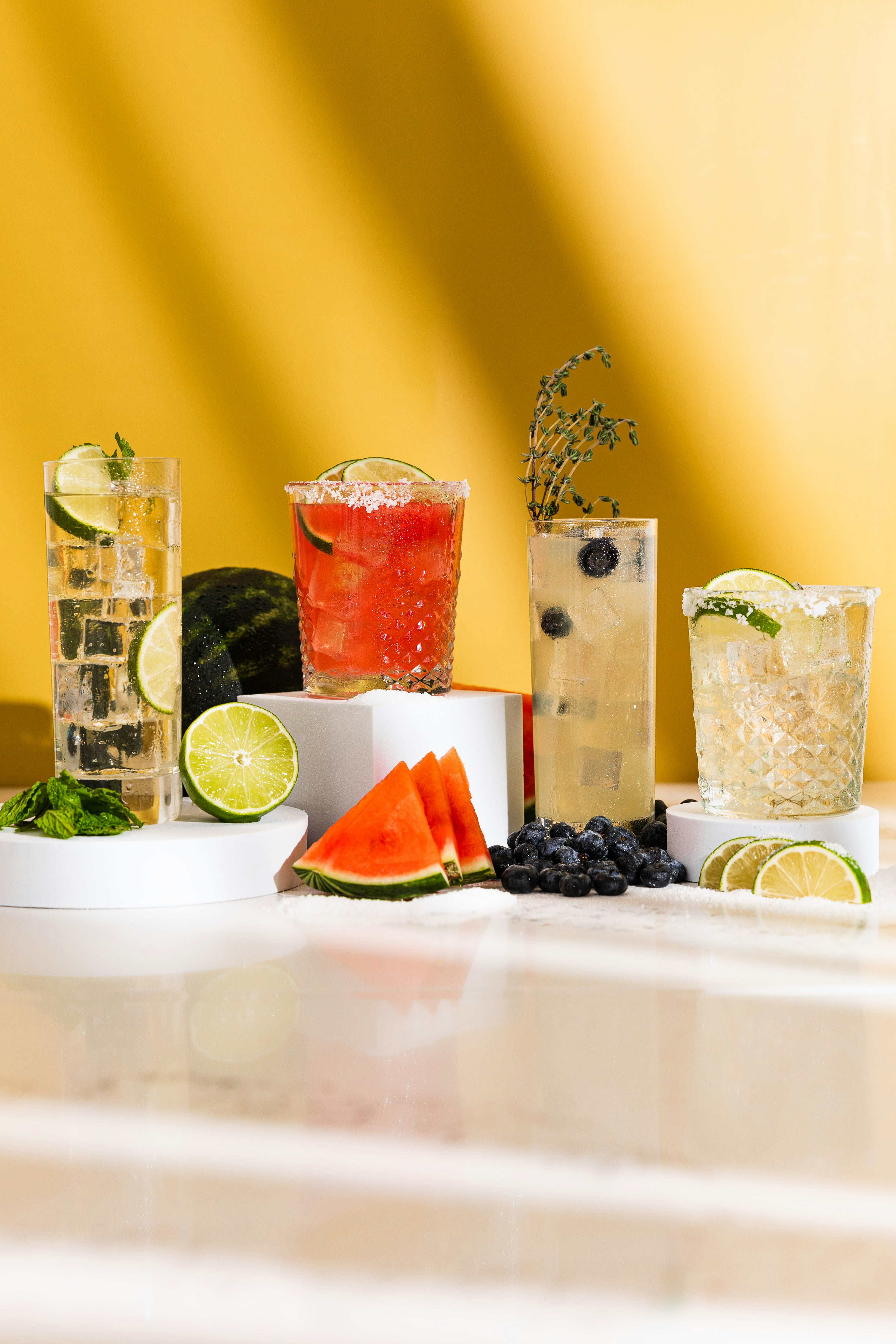 Variety Of Refreshing Cocktails With Fruit Garnishes HD mobile wallpaper