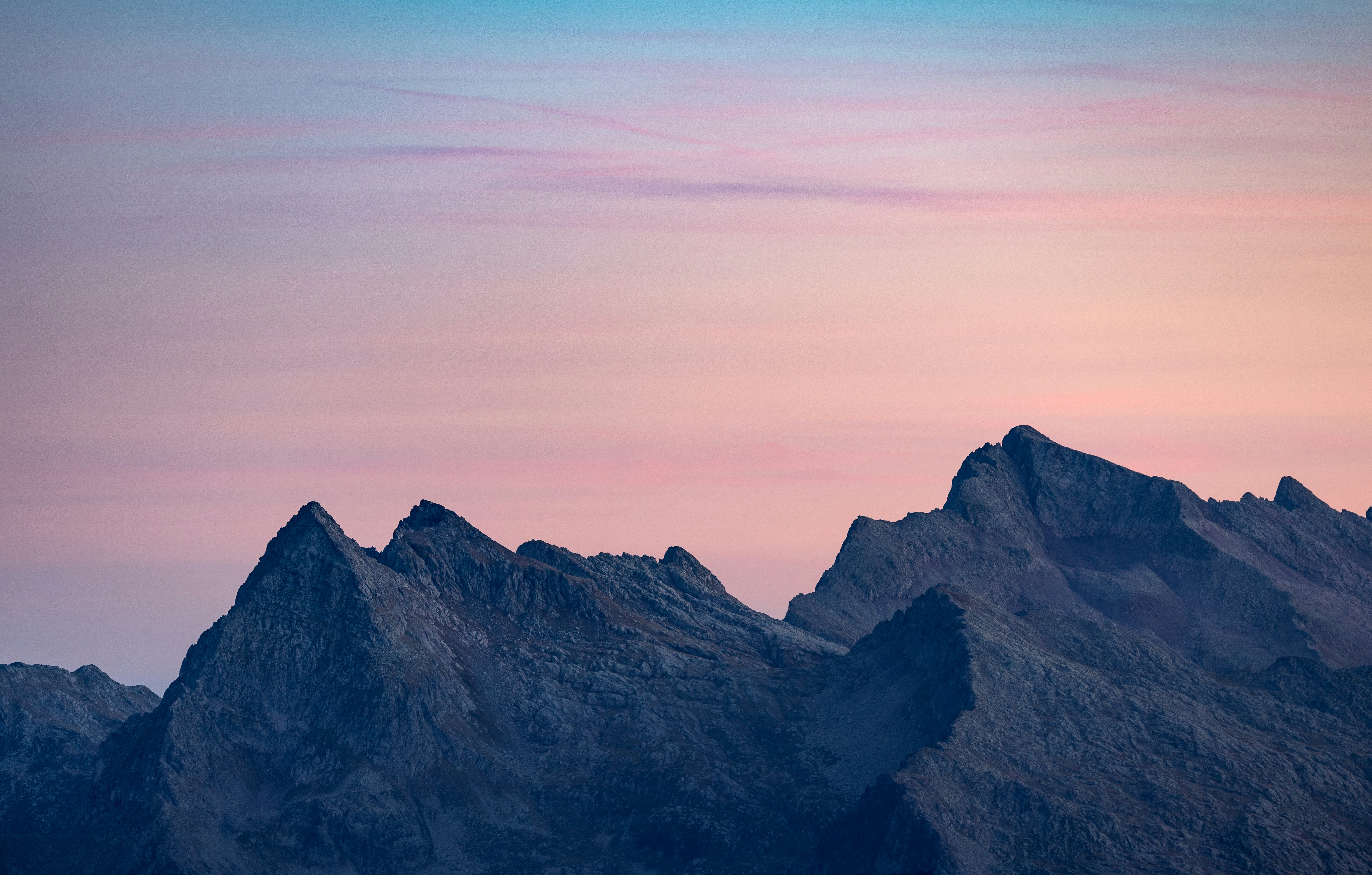 Jagged Mountain Peaks Under A Pastel Sky HD mobile wallpaper