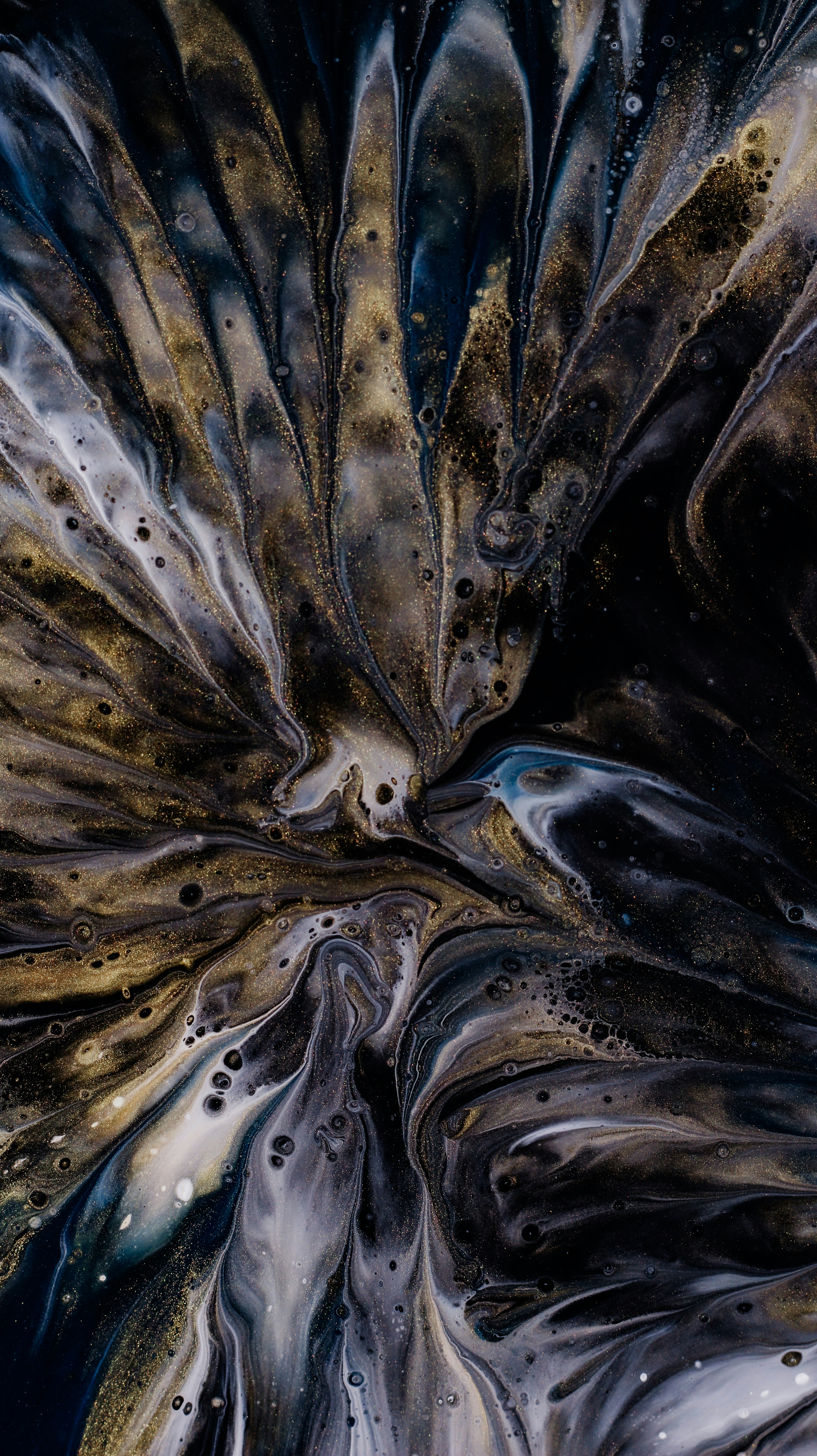 A Close Up Of A Black And Gold Abstract Painting