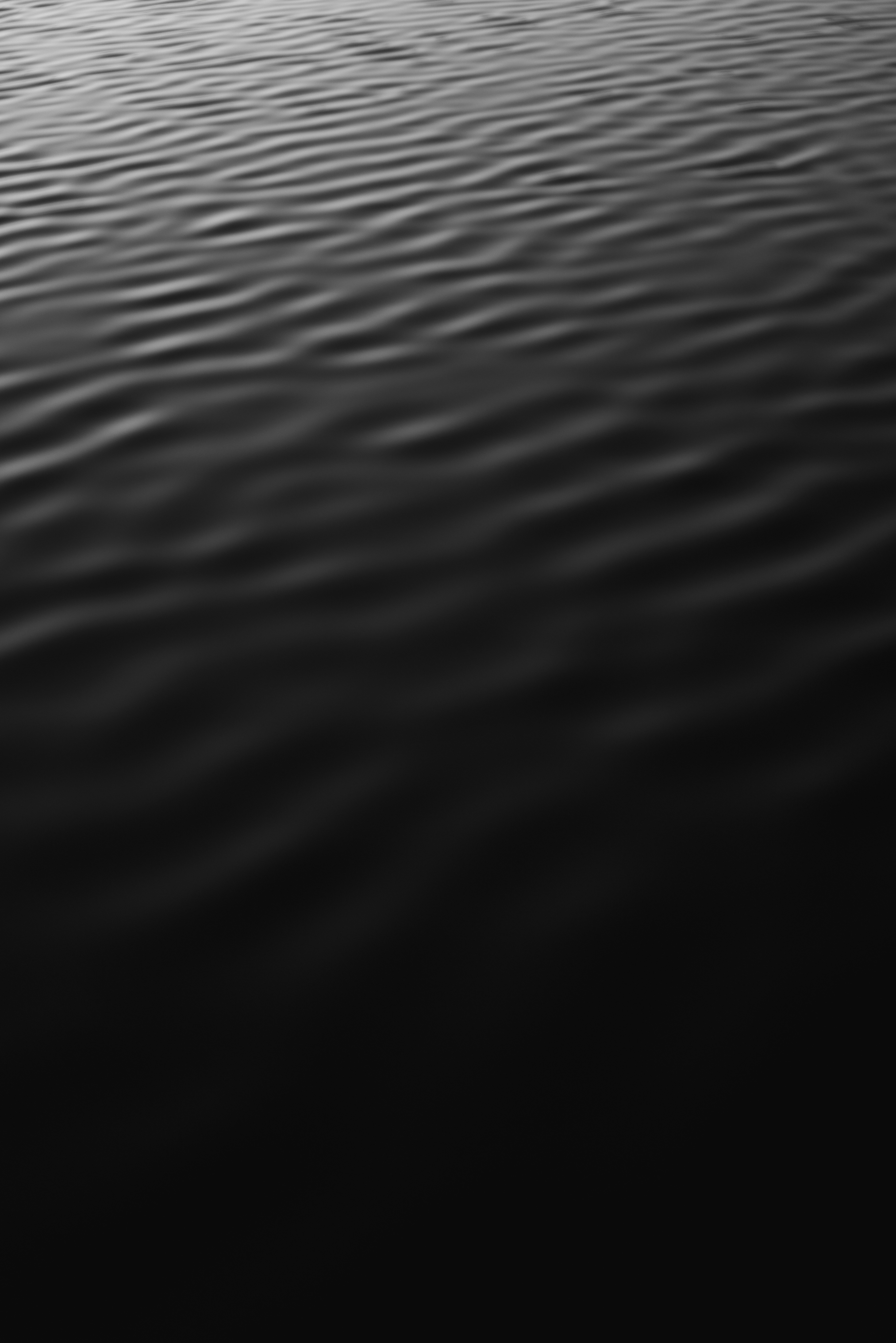 A Black And White Photo Of A Body Of Water
