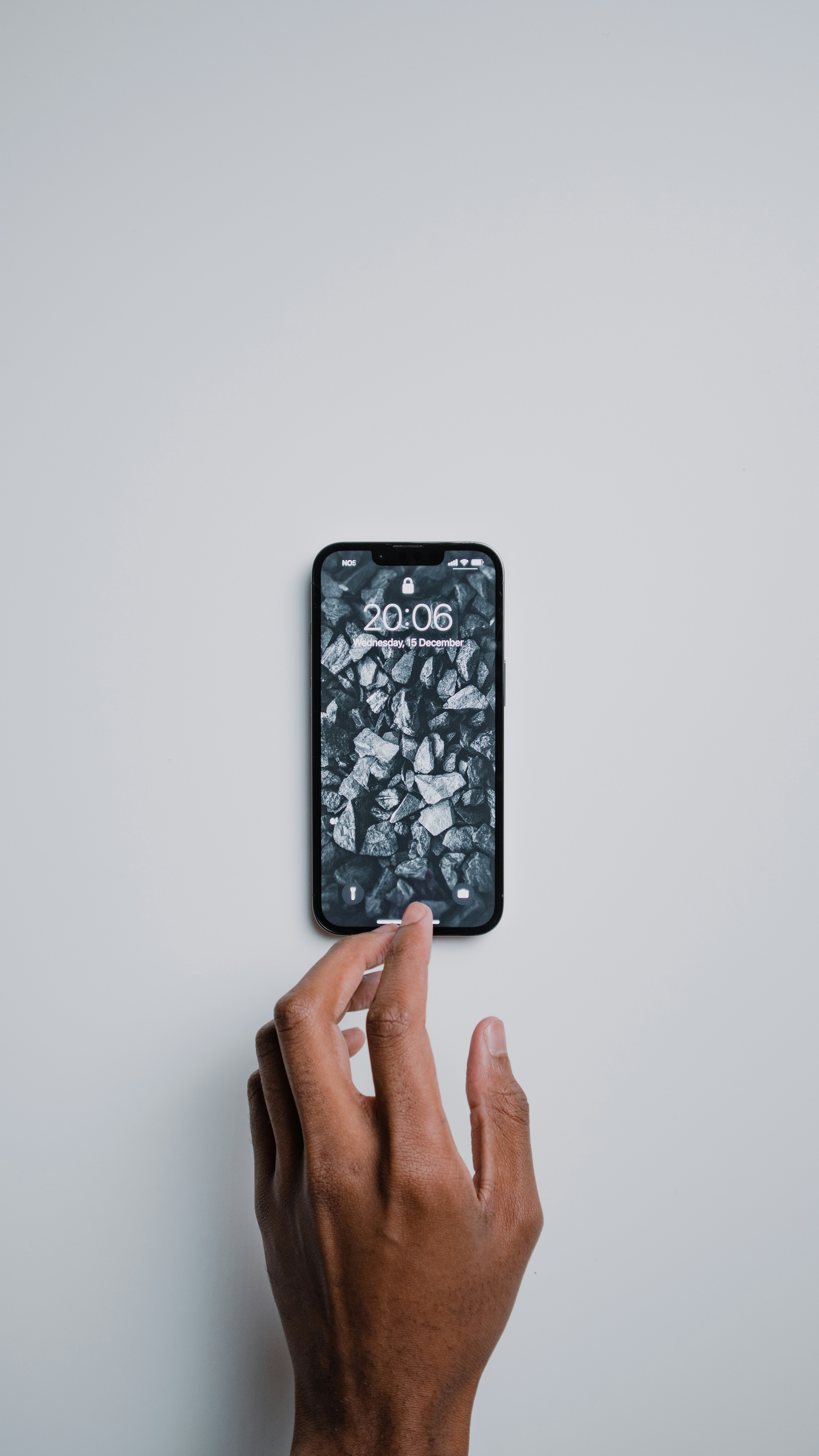 A Person Holding A Cell Phone In Their Hand