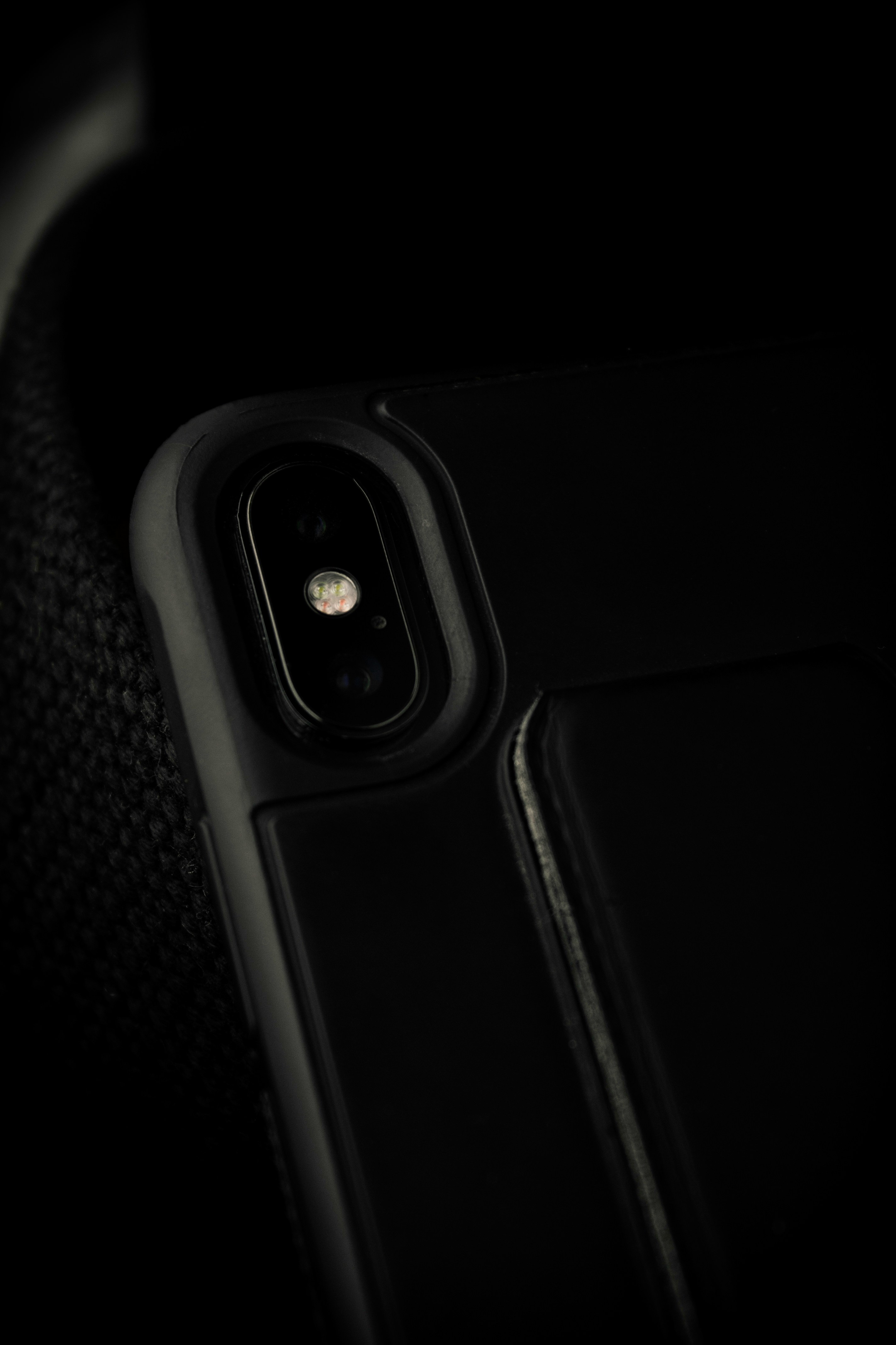 A Close Up Of A Cell Phone In The Dark